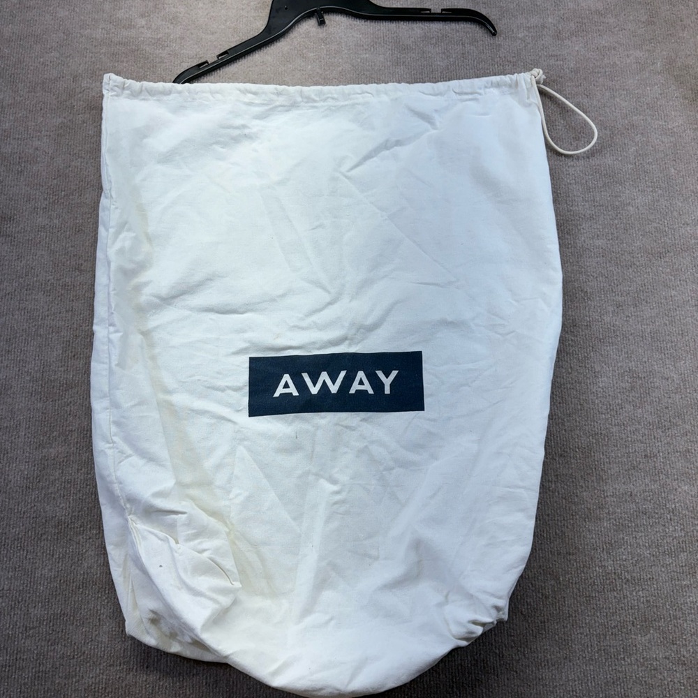 Laundry Bag Says Away On The Front Has a Drawstring